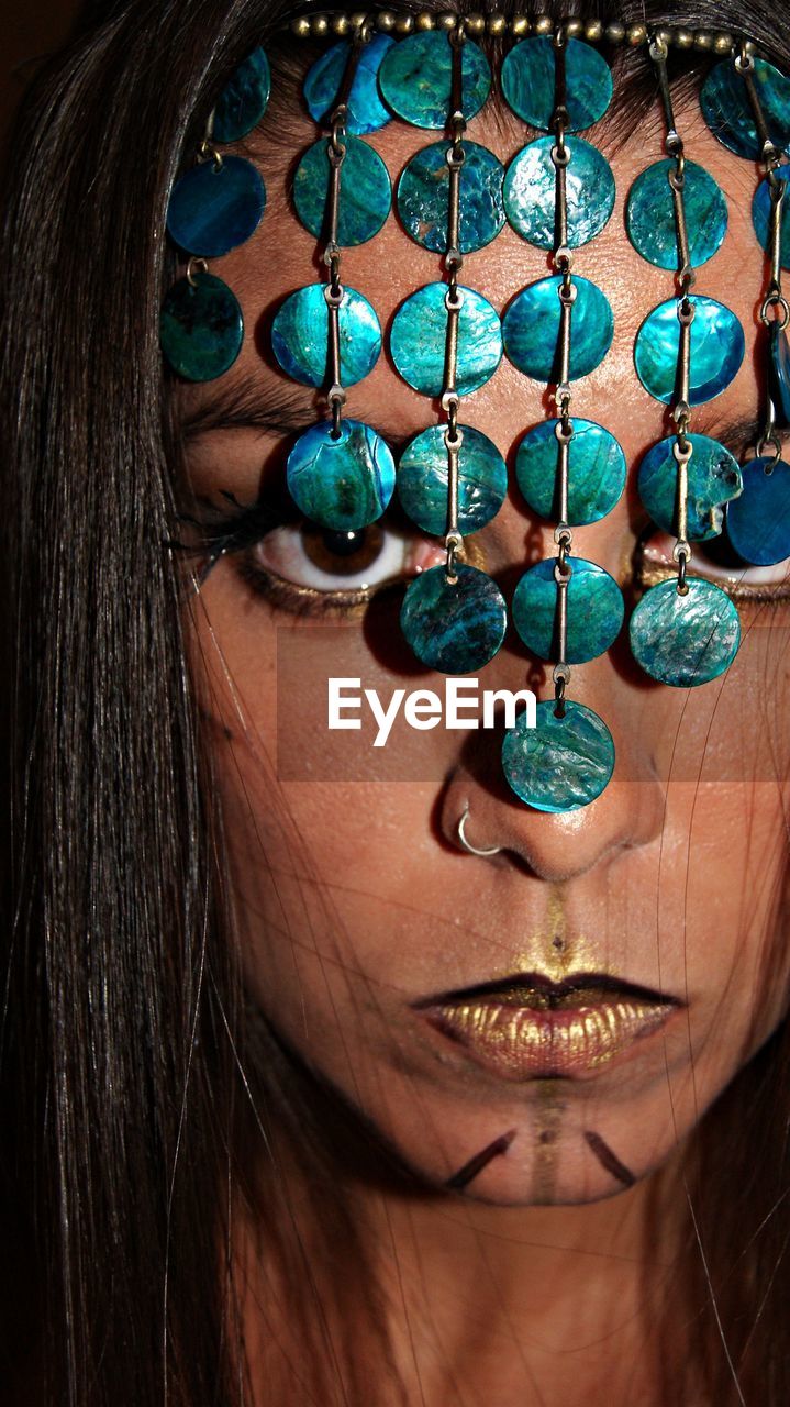 Close-up portrait of woman wearing headdress during halloween