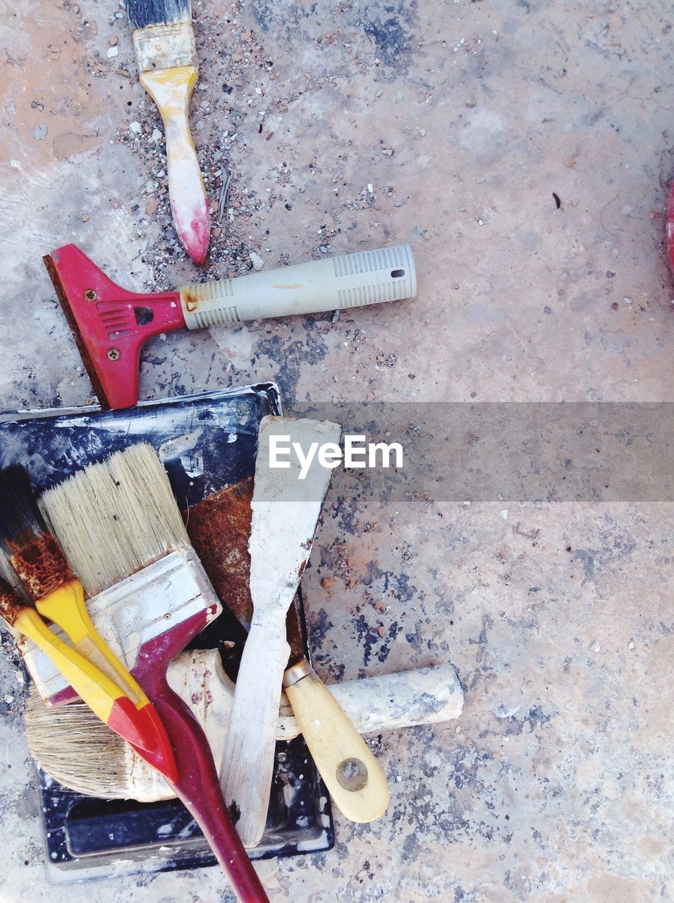 High angle view of paintbrushes on paint tray