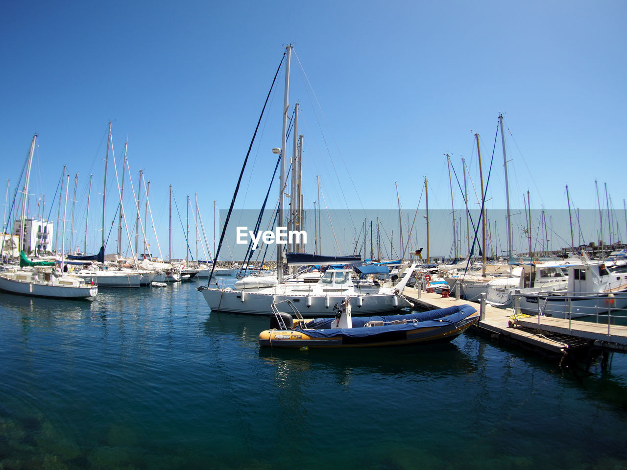 Boats moored at harbor