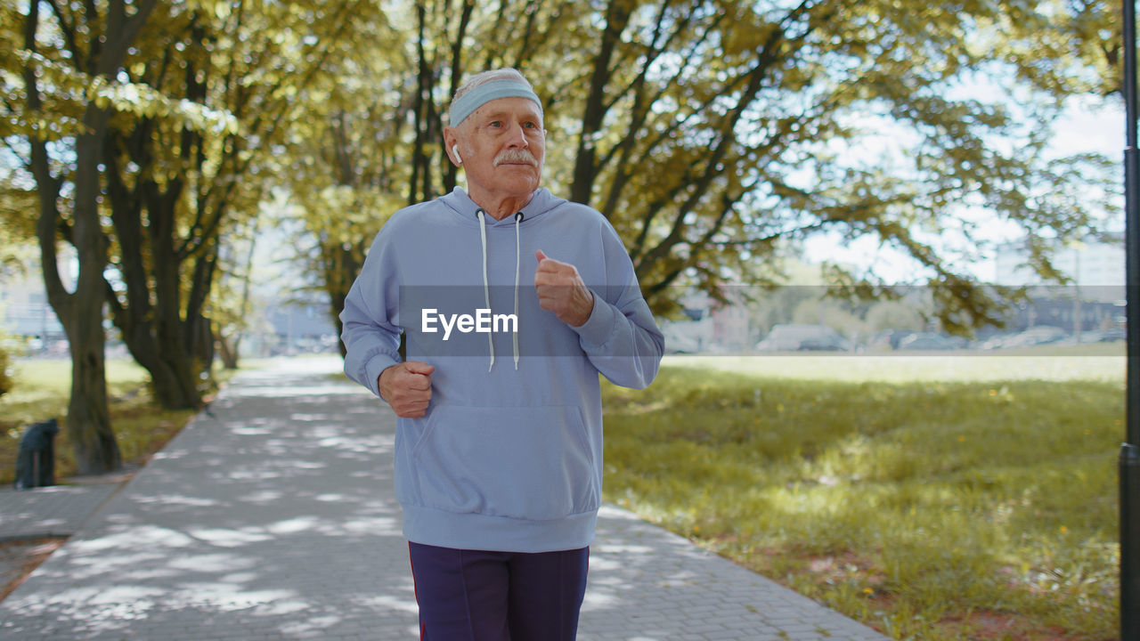 Dedicated senior man jogging in park