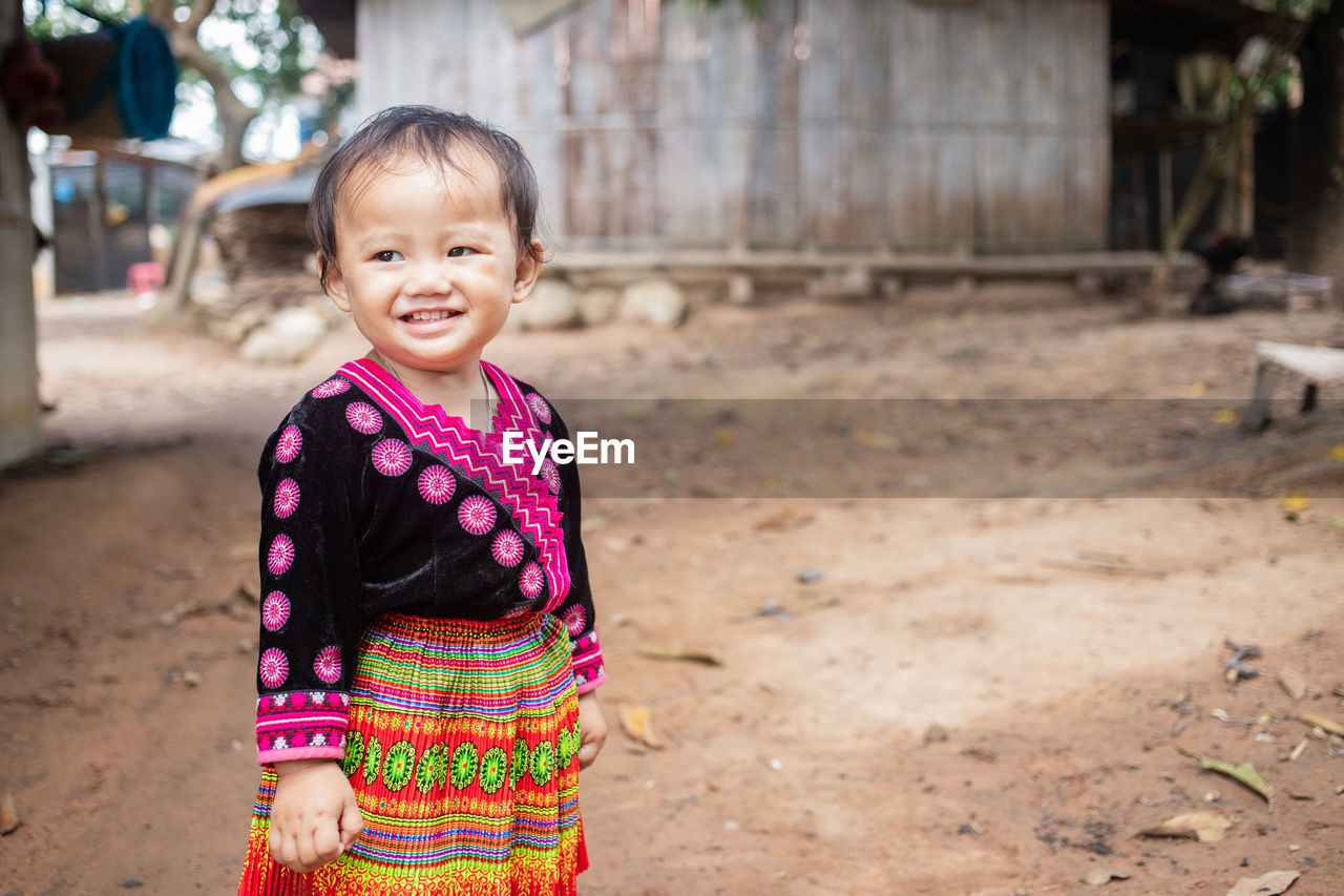 PORTRAIT OF SMILING GIRL