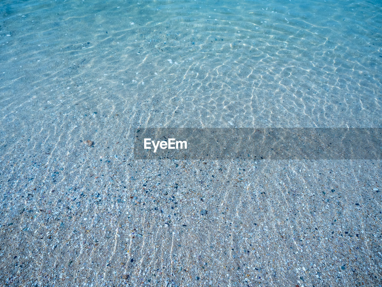 HIGH ANGLE VIEW OF SWIMMING POOL IN SEA