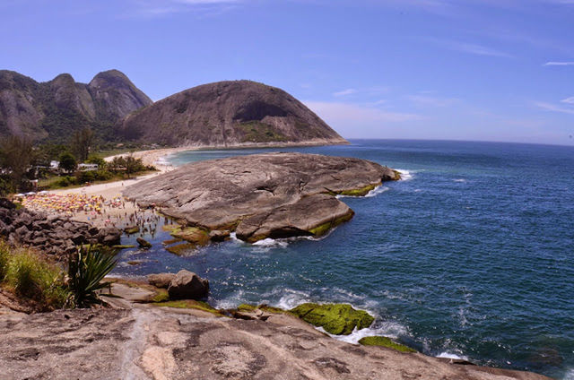 SCENIC VIEW OF SEA WITH ROCKS IN BACKGROUND