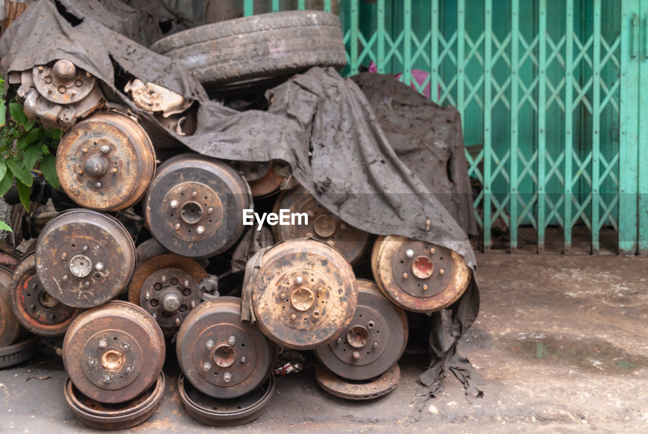 Close-up of abandoned vehicle parts on street