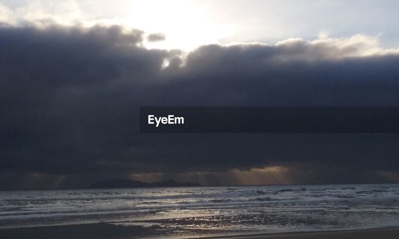 VIEW OF SEA AGAINST CLOUDY SKY