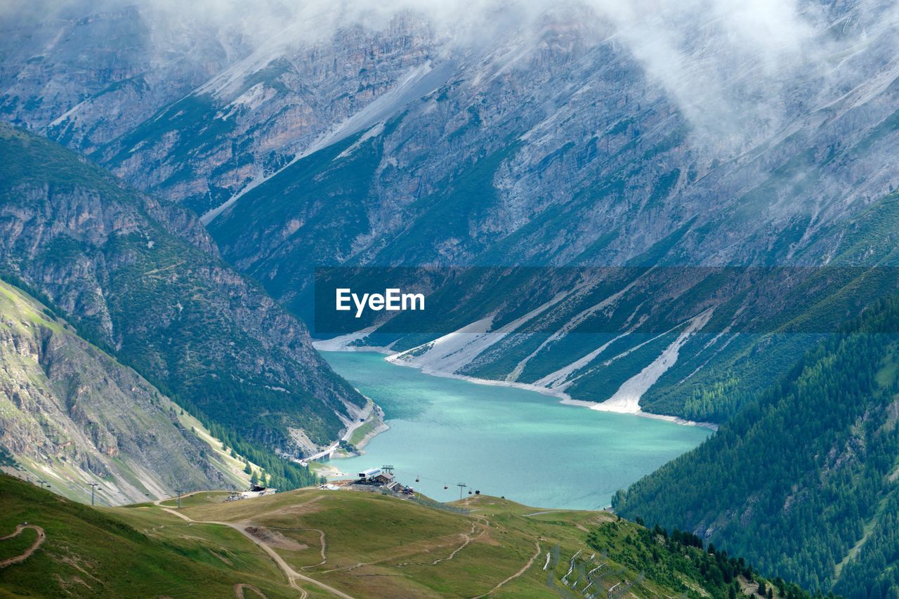 Scenic view of river amidst mountains