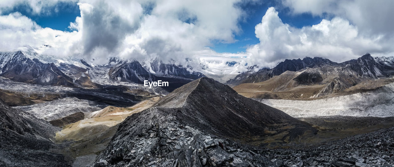 Panoramic view of snowcapped mountains against sky