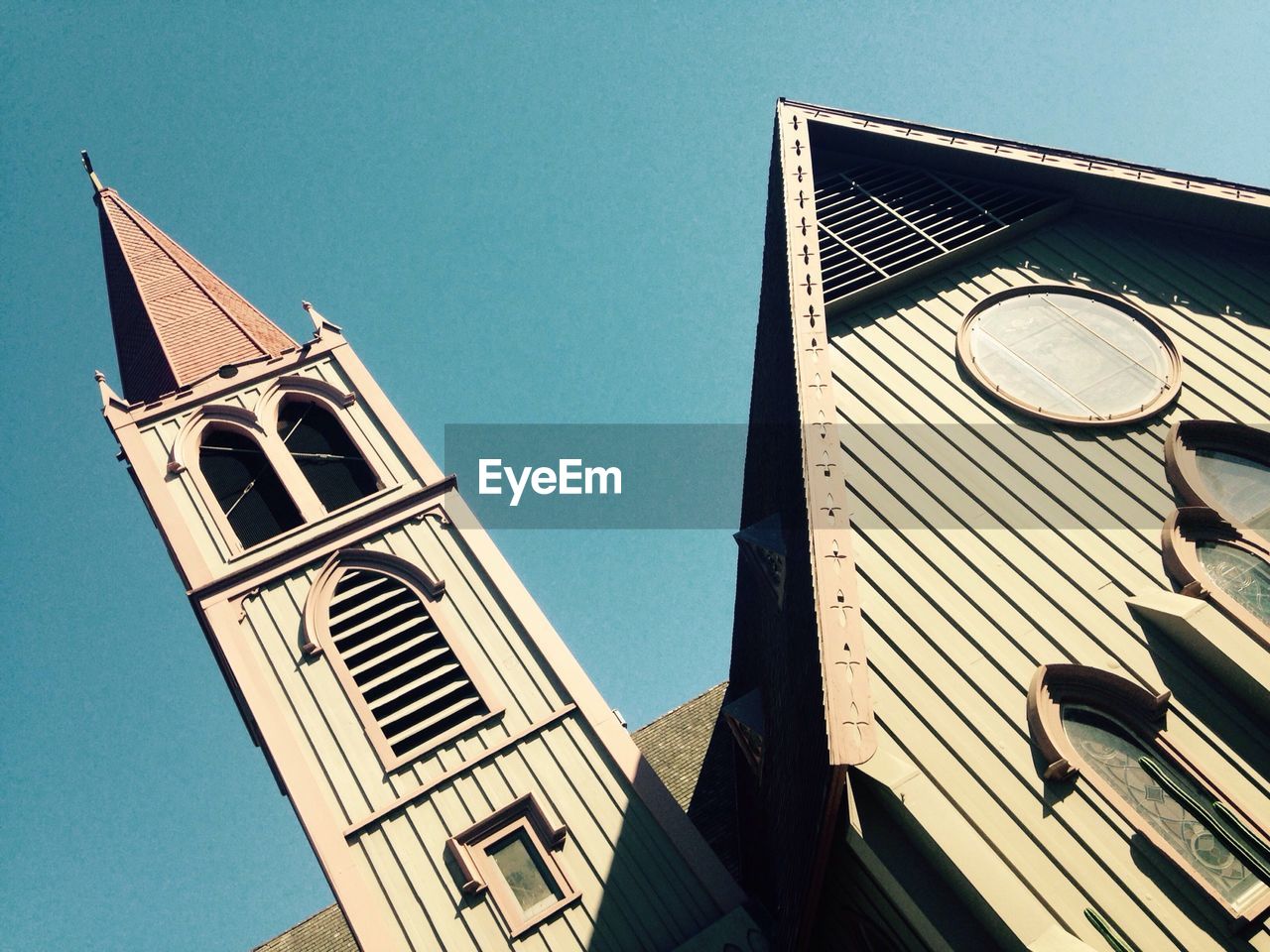 High section of church against clear blue sky