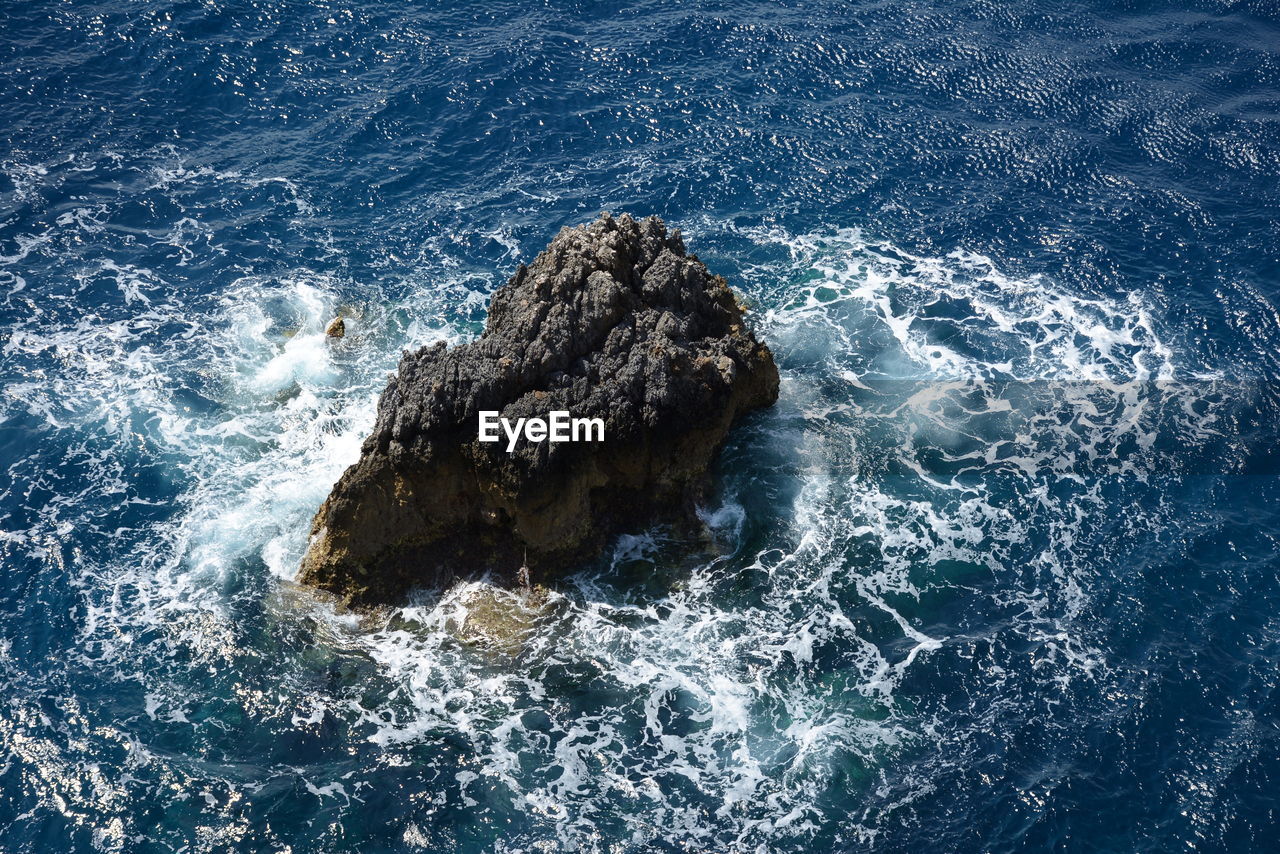 Close-up of rock in sea