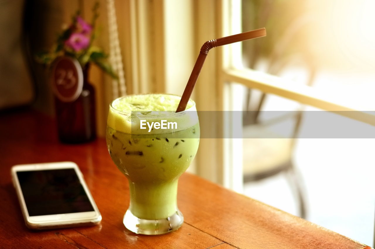 Close-up of drink served on table