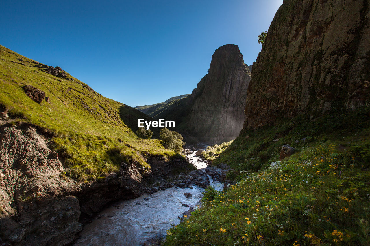 Scenic view of mountains against clear sky