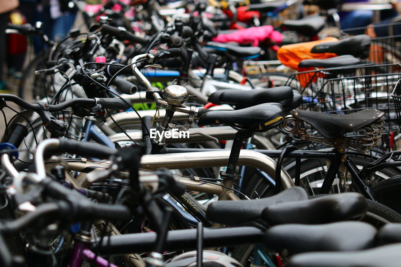 Close-up of bicycles parked outdoors