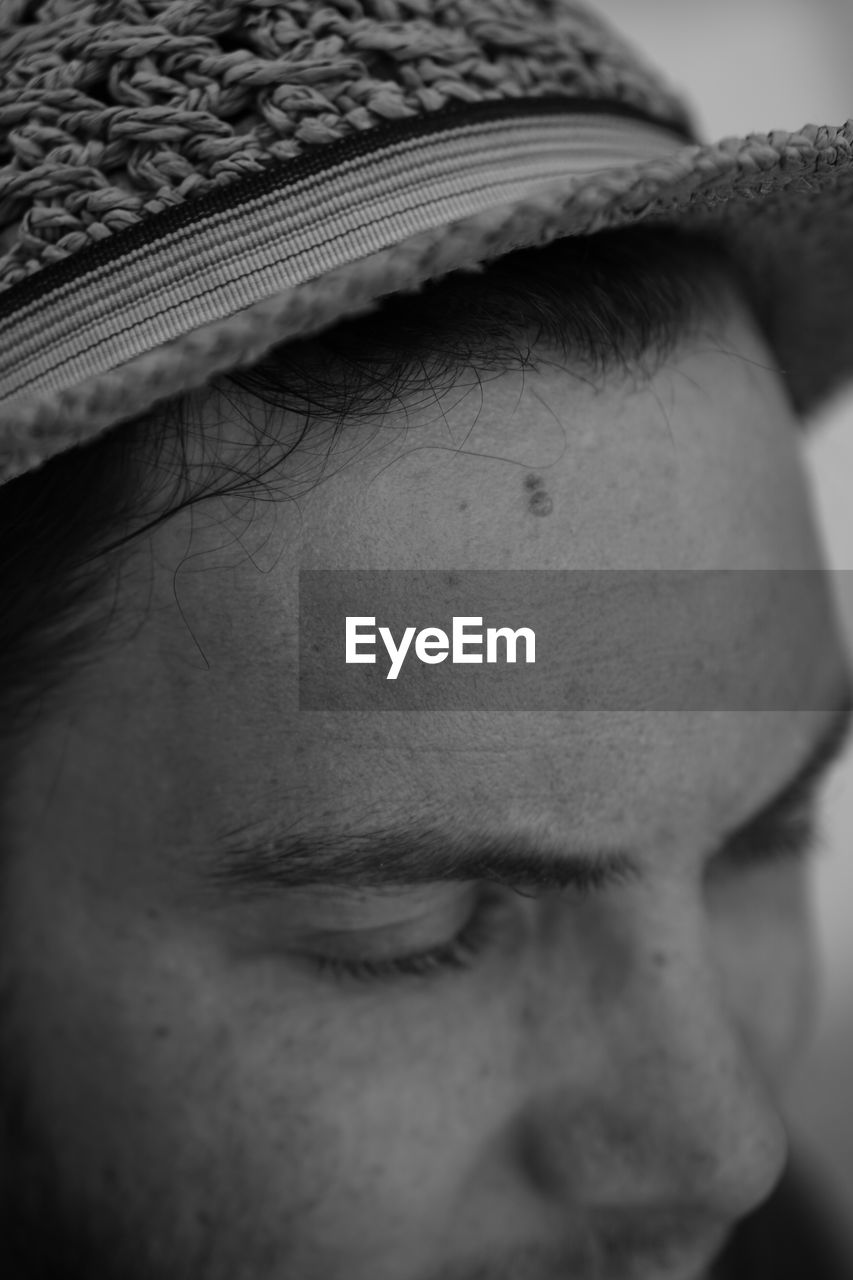 Close-up portrait of boy wearing hat