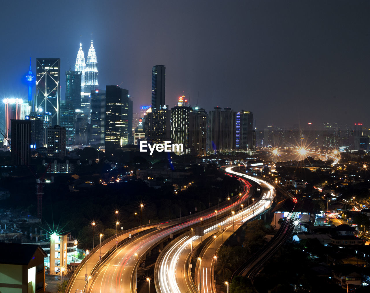 Traffic on highway in city at night