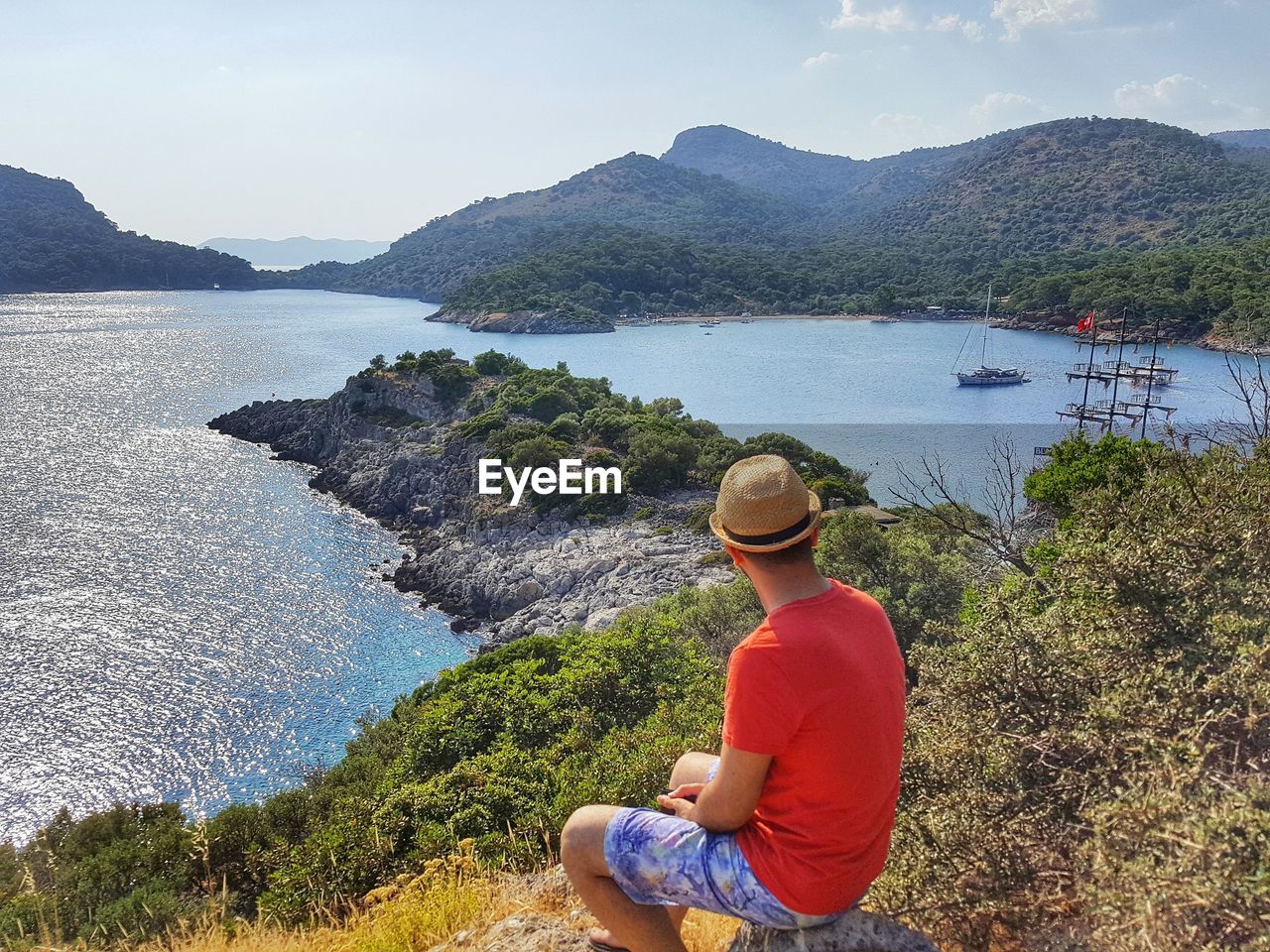 Rear view of man looking at sea