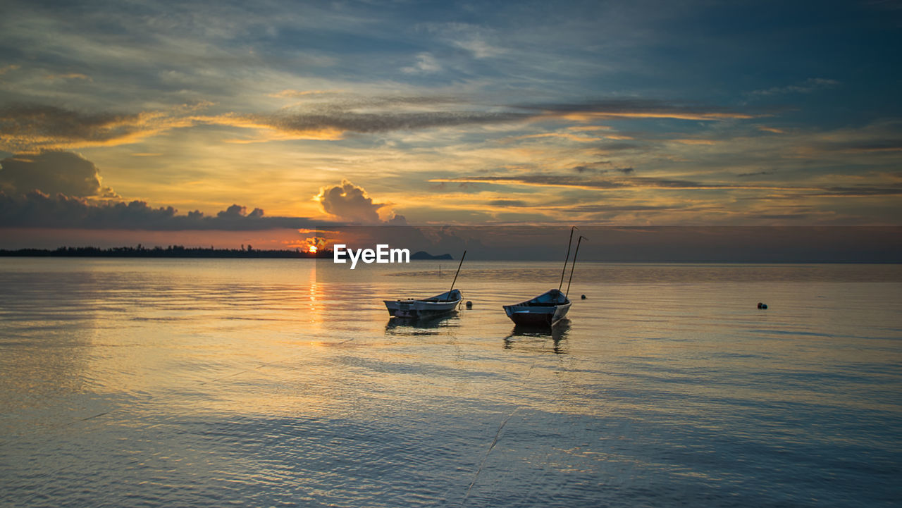 Scenic view of sea against dramatic sky