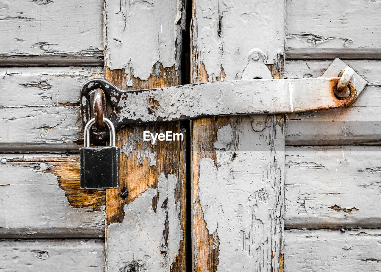 FULL FRAME SHOT OF CLOSED DOOR WITH PADLOCK