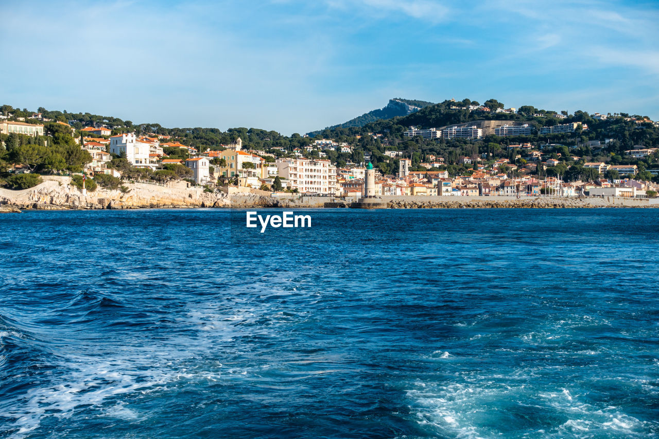 The town of cassis seen from a boat in a beautiful sunny day, france