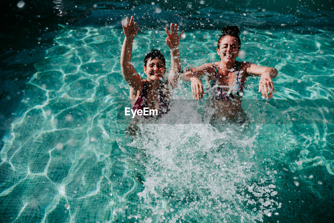 Women enjoying in swimming pool