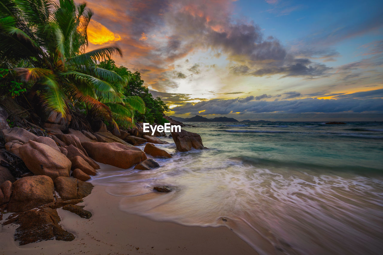 scenic view of sea at sunset