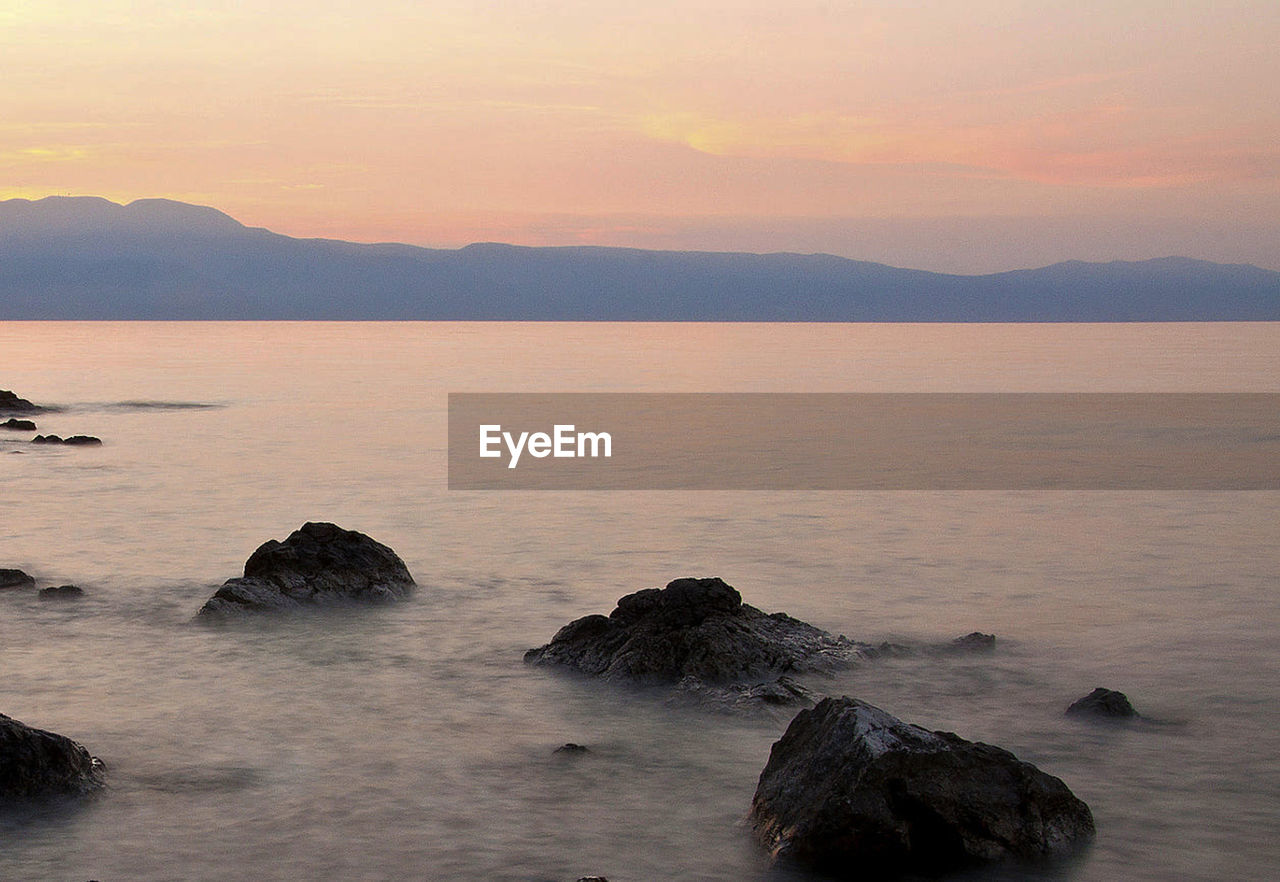 Scenic view of sea against sky during sunset