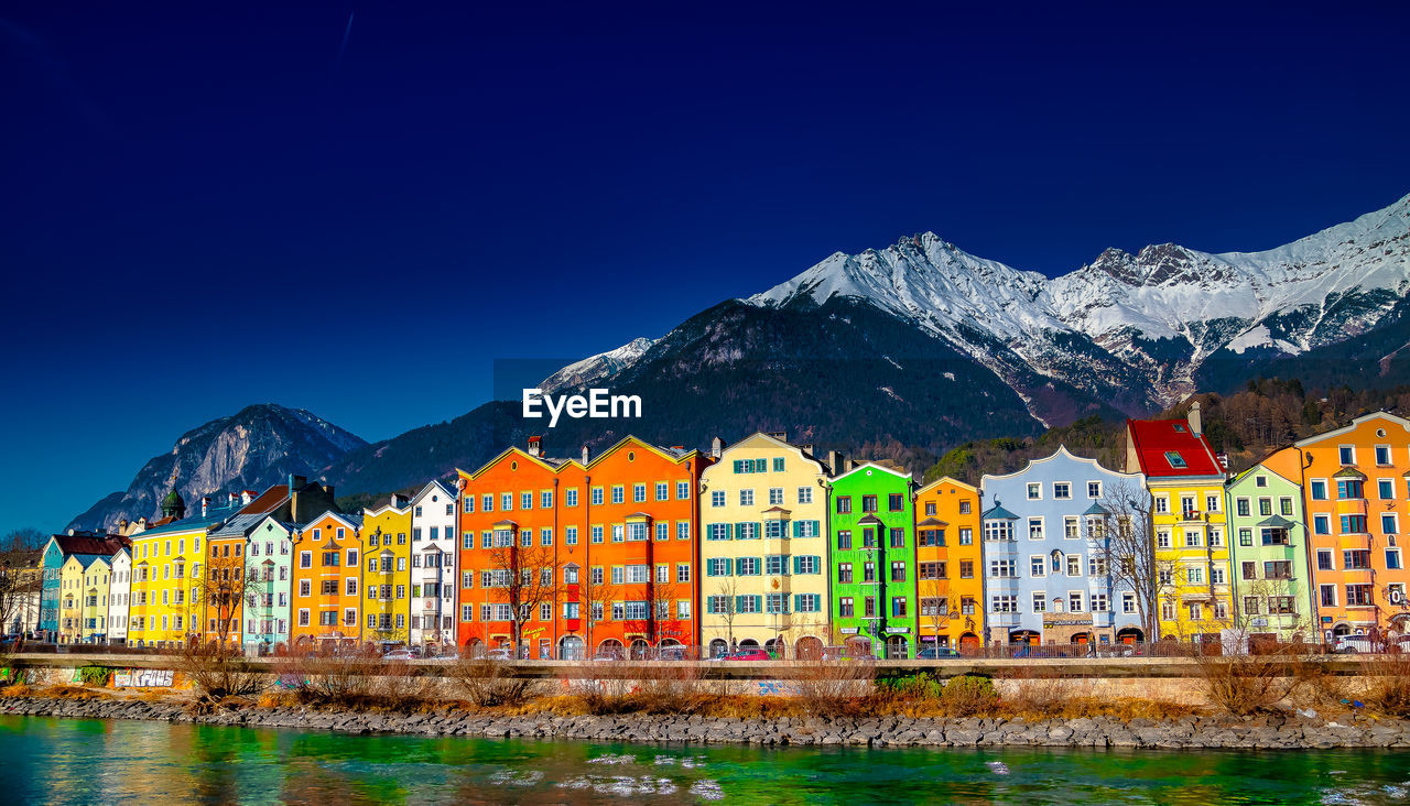 Buildings against blue sky during winter