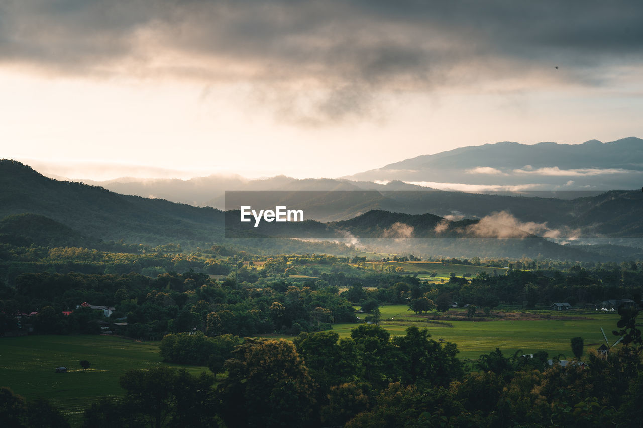 Aerial view of mountains against sky during sunset