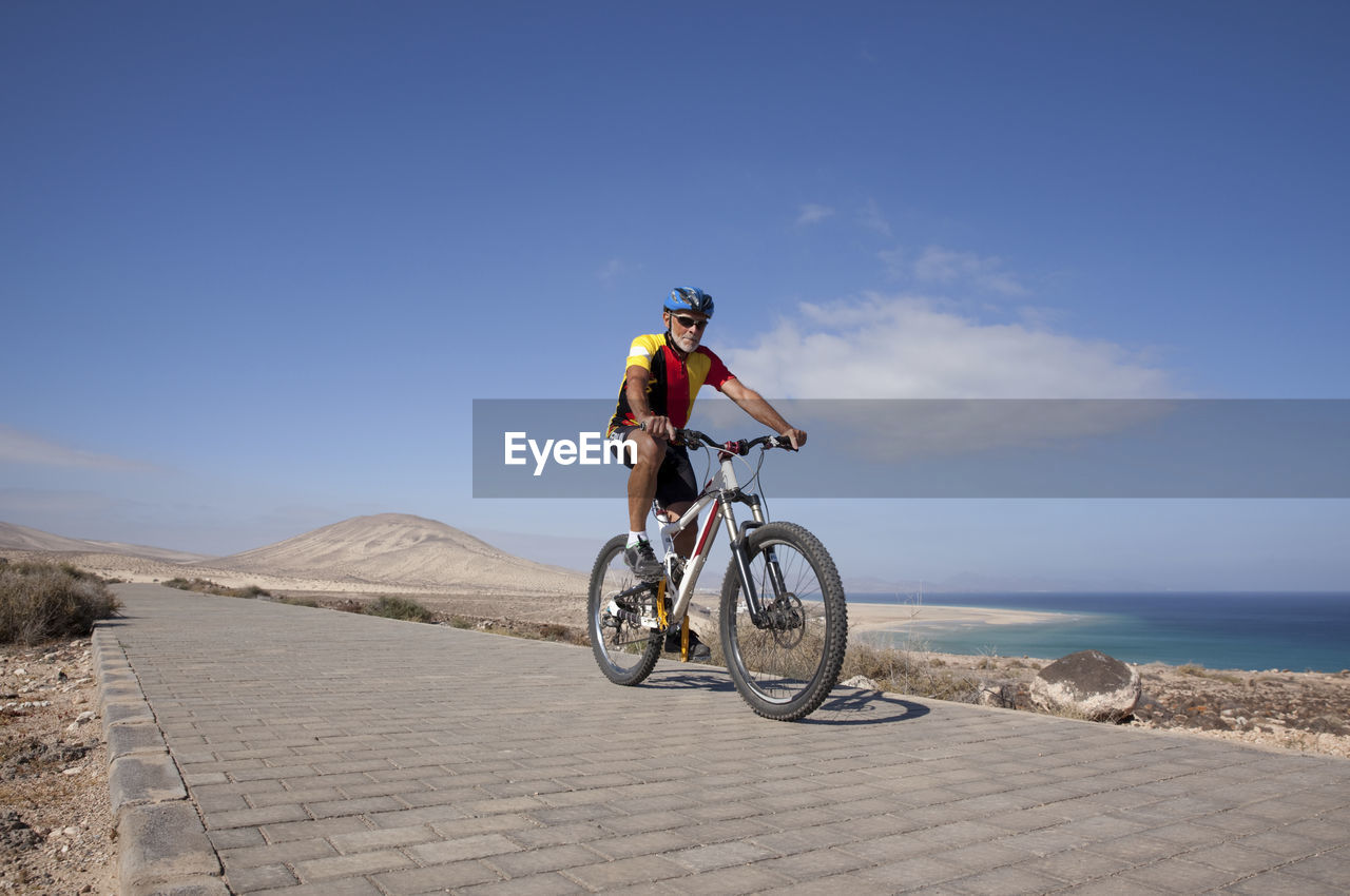 Spain, canary islands, fuerteventura, senior man on mountainbike