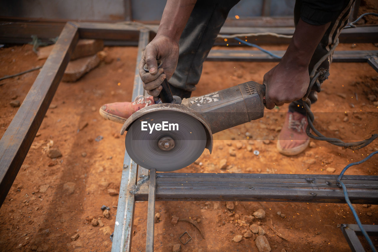 Zambian welder, welding , african man working with his hands 