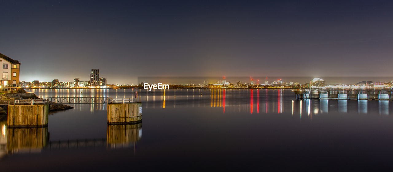 Cardiff bay at night with the lights reflected in the water hdr