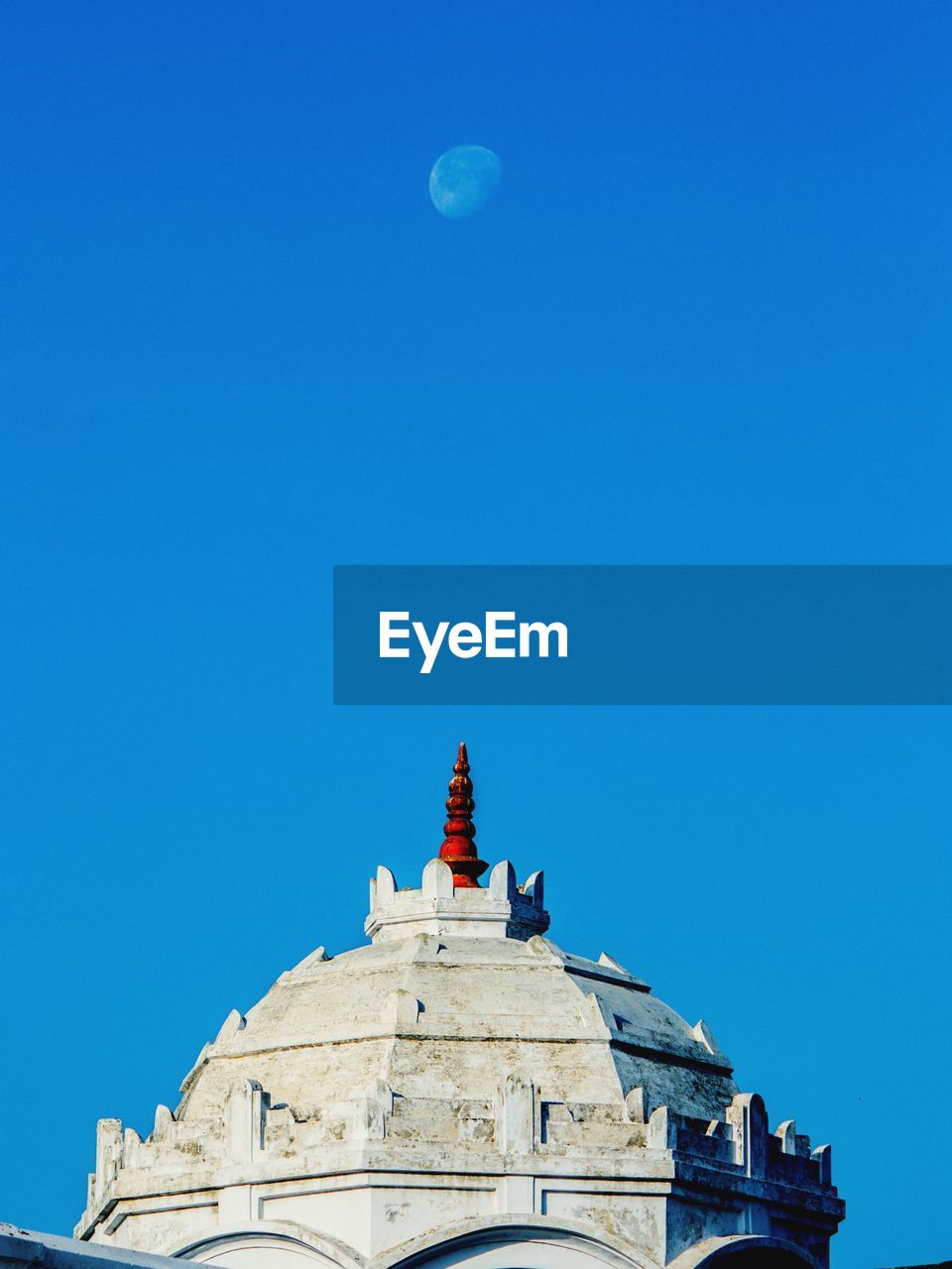 Low angle view of a building against blue sky