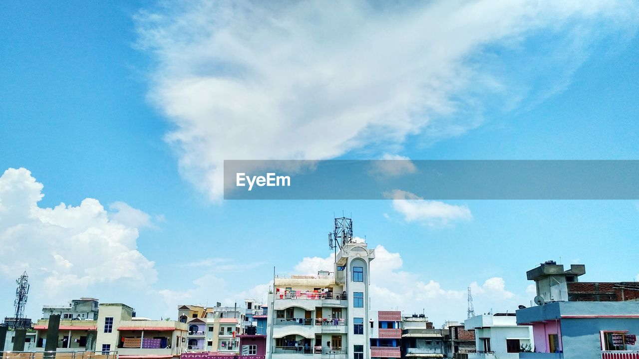 BUILDINGS IN CITY AGAINST SKY