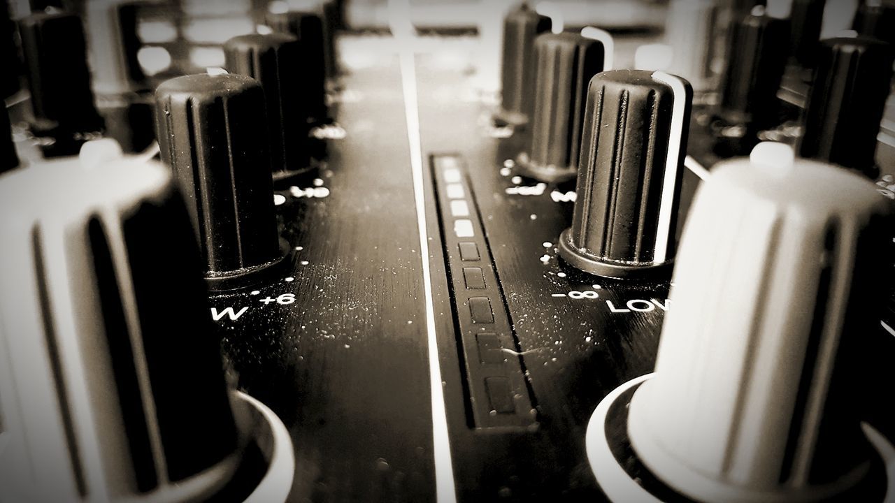 CLOSE-UP OF SOUND MIXER AT HOME