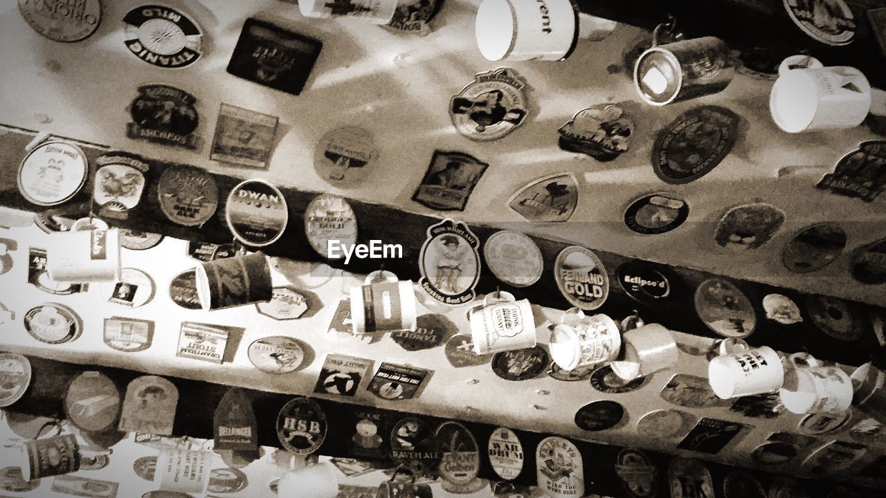 Low angle view of cups hanging on ceiling in restaurant