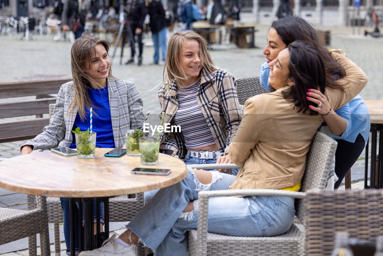 group of friends having food at restaurant