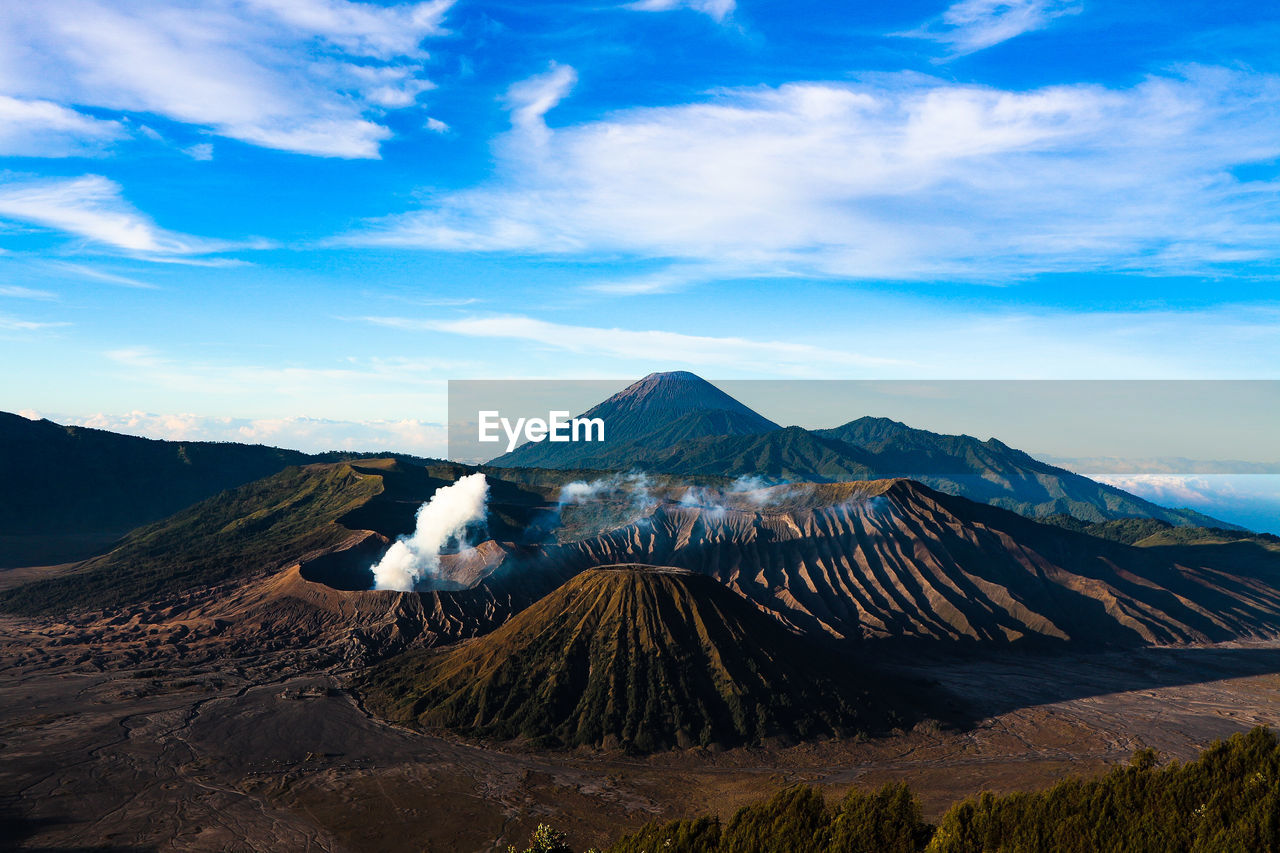 Scenic view of mountain range against cloudy sky in east java indonesia