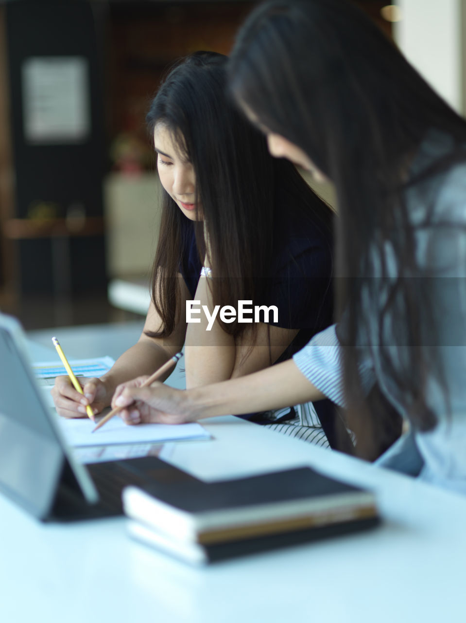 Smiling businesswomen working at office