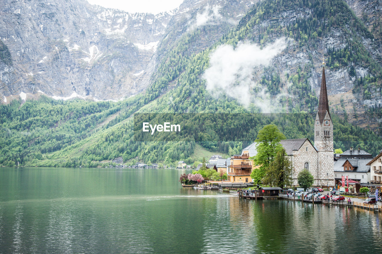 SCENIC VIEW OF LAKE AGAINST MOUNTAIN