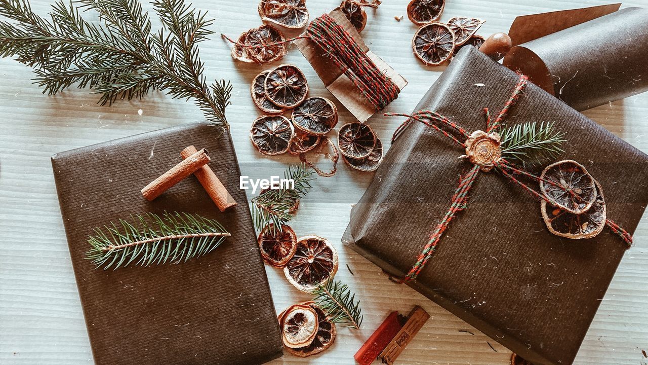 Directly above of christmas present and decorations on table