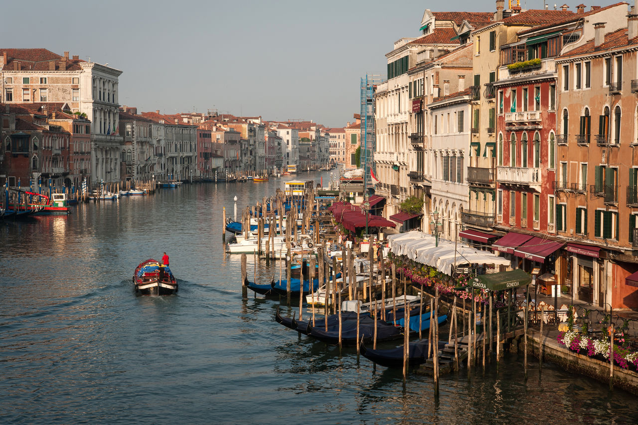 High angle view of boats in canal against buildings