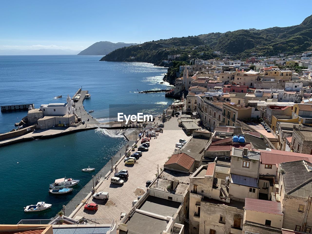 High angle view of sea and buildings against sky