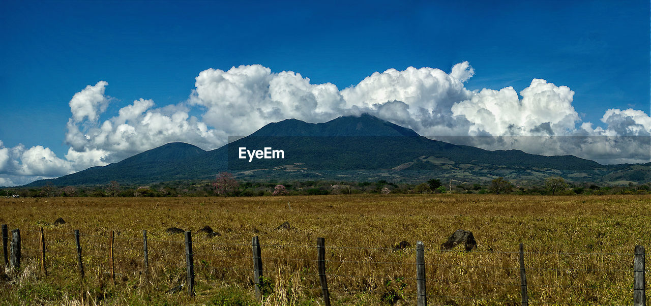 Scenic mountain against cloudy sky