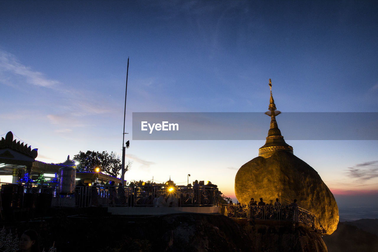 Panoramic view of buildings in city against sky during sunset