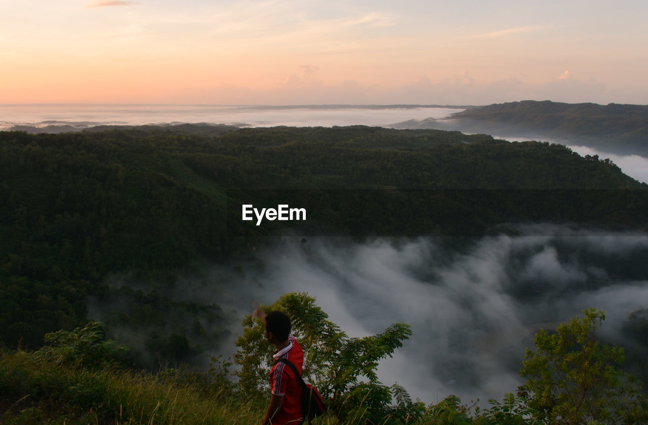 High angle view of man during sunset