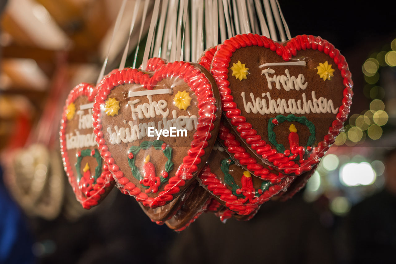 CLOSE-UP OF HEART SHAPE MADE OF COOKIES HANGING