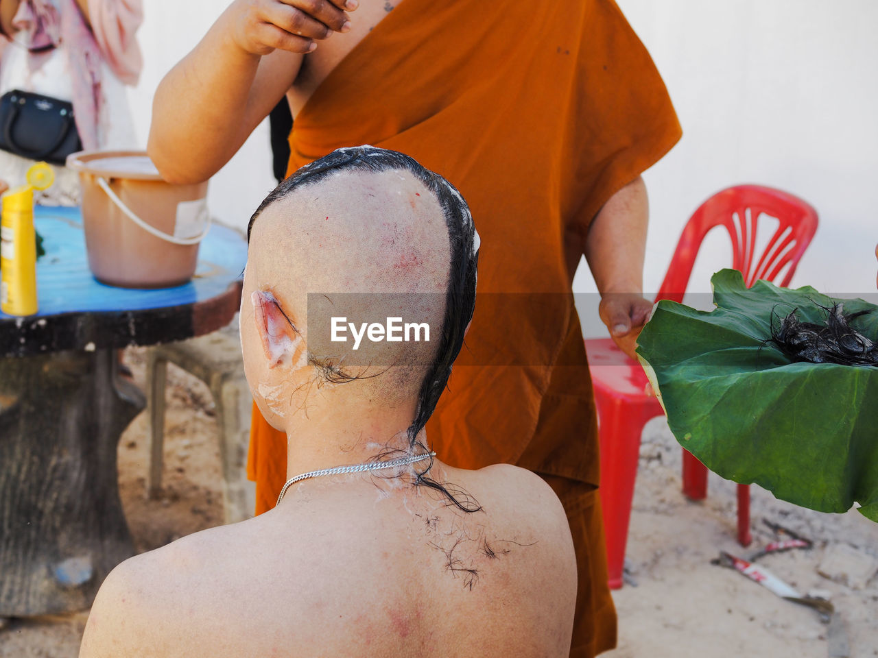 Barber shaving head of man