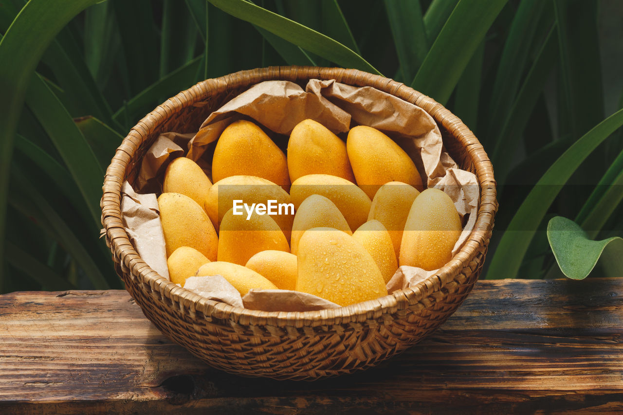 High angle view of mangoes in basket