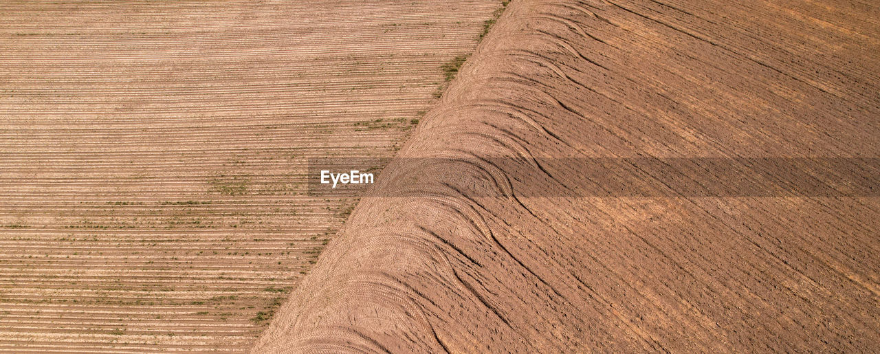 landscape, floor, flooring, pattern, backgrounds, wood, land, wood flooring, brown, no people, full frame, environment, hardwood, agriculture, nature, textured, rural scene, laminate flooring, soil, high angle view, scenics - nature, day, outdoors, farm, wood stain, beauty in nature, field, cereal plant, plant