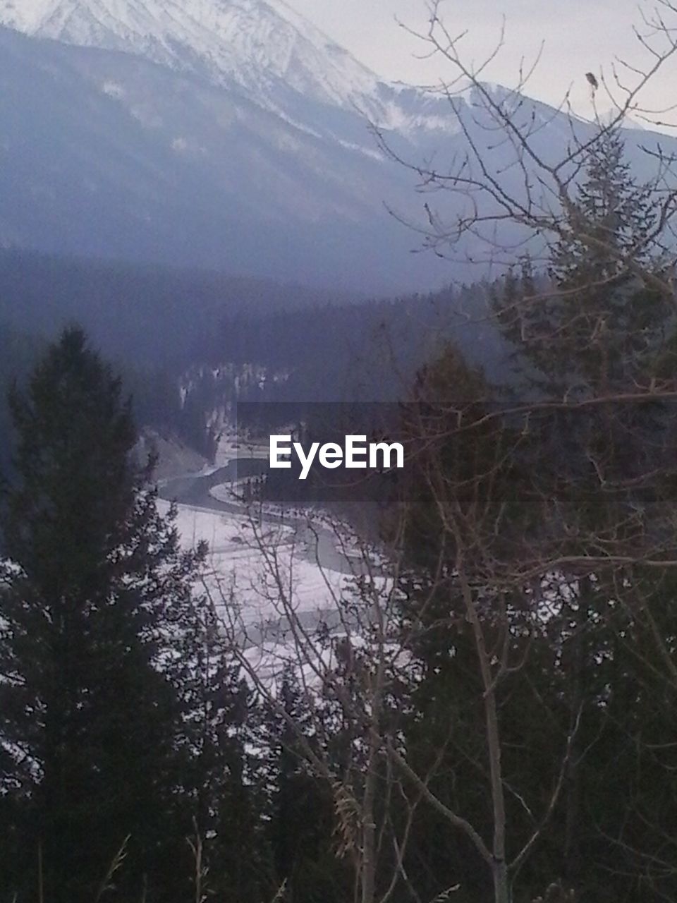 SCENIC VIEW OF LAKE WITH MOUNTAINS IN BACKGROUND