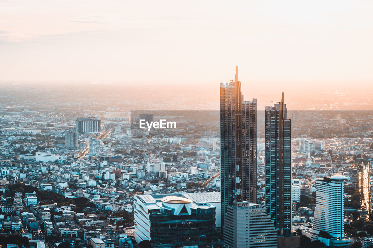 Sunset and twilight view of city. seen from mahanakhon tower famous skyscrapers